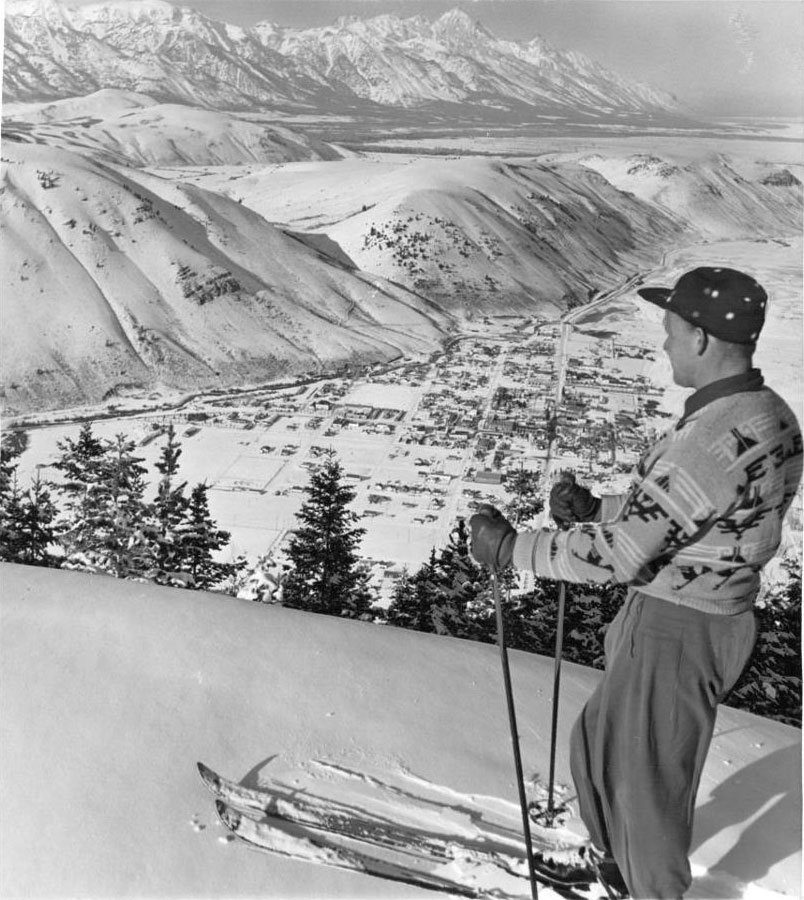 A skier stands at the top of Snow King Mountain with views of Jackson Hole, WY in 1959.