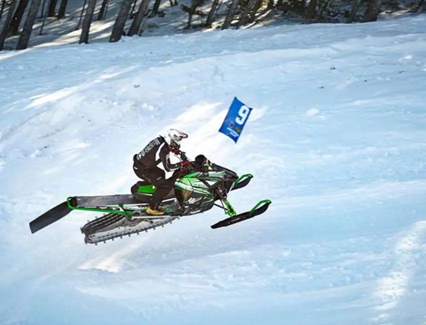A person rides a snowmobile uphill at Snow King Mountain in Jackson Hole, WY.